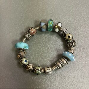 Pandora bracelet with 17 charms, authentic, sterling silver, circa 2011-before